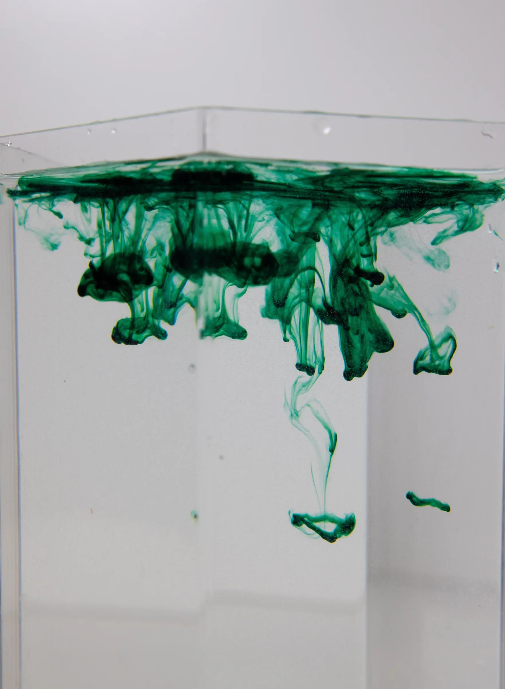 Aqua paint flow representing water-based coating development